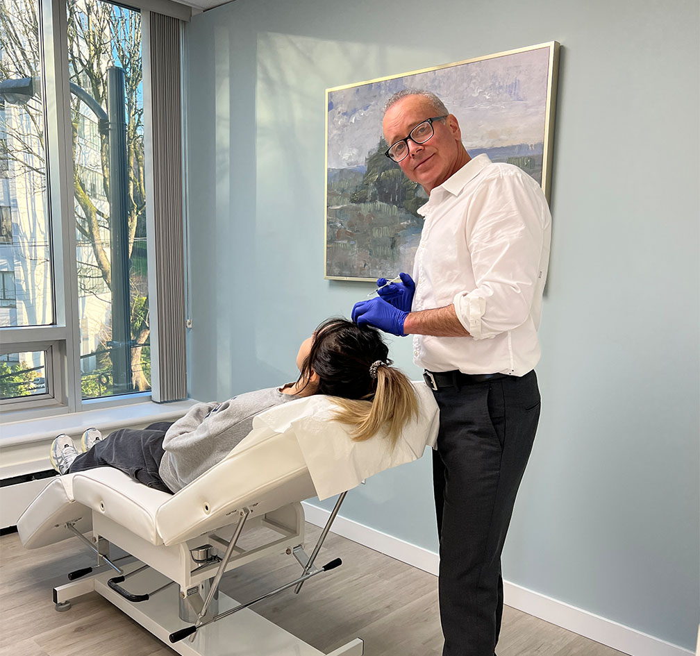 Dr. Brock with a patient.